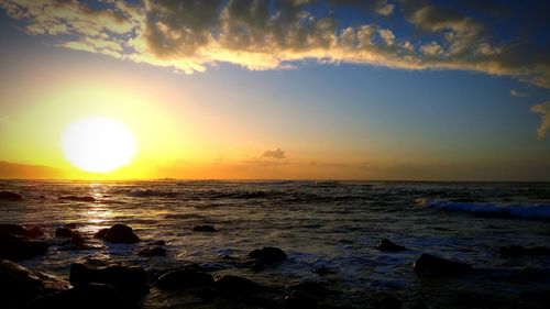 Scenic view of sea at sunset