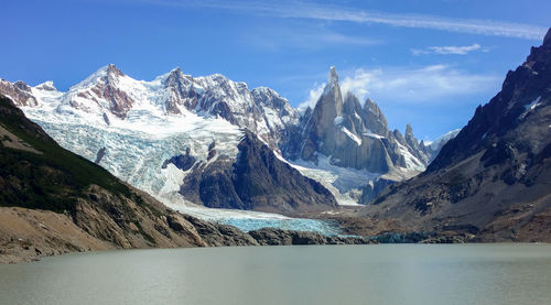 Scenic view of snowcapped mountains against sky