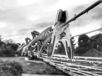 Close-up of bicycle by tree against sky