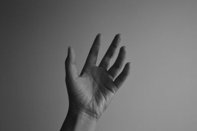 Close-up of hand against white background