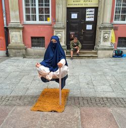 Full length of woman standing in city