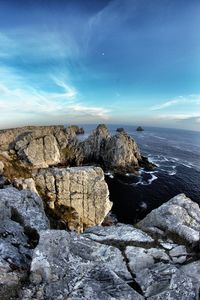 Scenic view of sea against cloudy sky