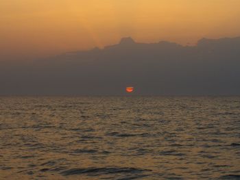 Scenic view of sea at sunset