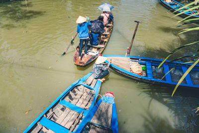 High angle view of people on boat in river