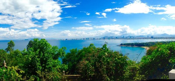 Scenic view of calm lake against cloudy sky