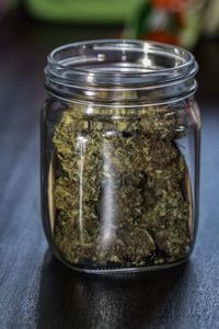 Close-up of glass jar on table