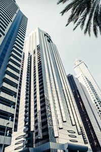 Low angle view of modern buildings against sky in city