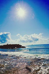 Scenic view of sea against blue sky