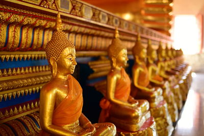 Buddha statue in temple outside building