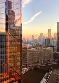 Digital composite image of buildings against sky at sunset