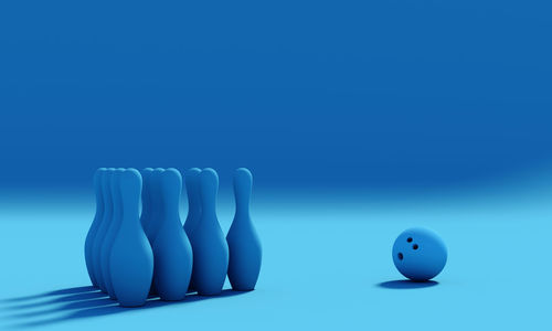 Close-up of balls on table against blue background