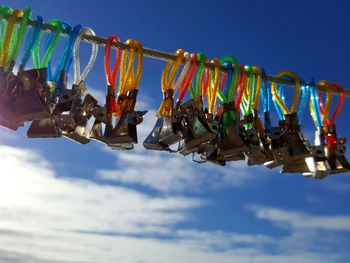 Low angle view of clothes drying against sky