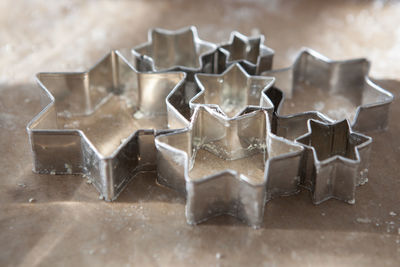 Close-up of pastry cutter on table