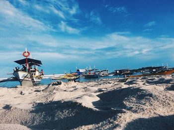 View of beach against cloudy sky