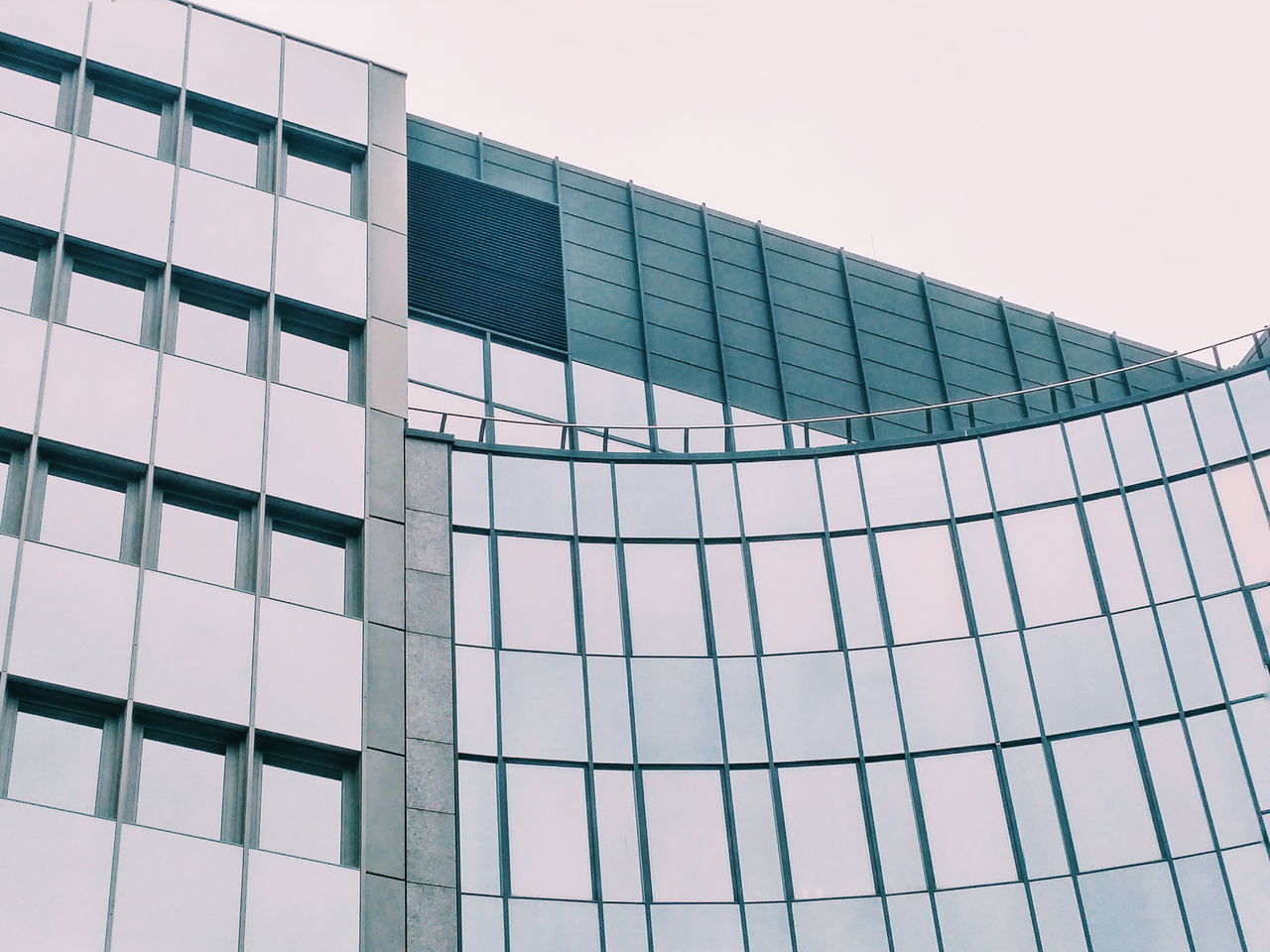 architecture, built structure, building exterior, low angle view, modern, glass - material, clear sky, office building, building, window, pattern, city, reflection, day, geometric shape, sky, full frame, backgrounds, repetition, no people