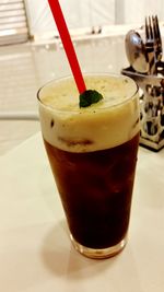 Close-up of beer in glass on table