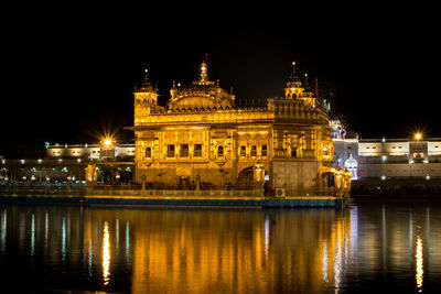 Reflection of illuminated buildings in water at night