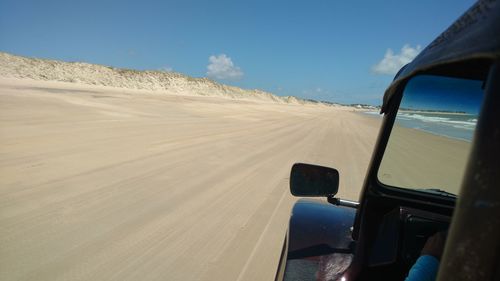 View of person enjoying beach drive