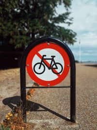 Close-up of bicycle lane sign on road