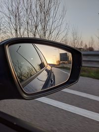 Reflection of car on side-view mirror