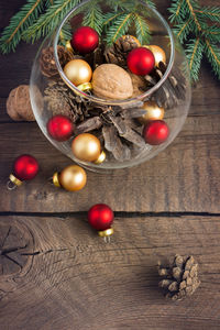 Pine cones, nuts and christmas toys in the glass
