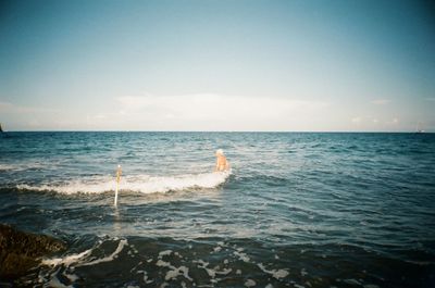 Scenic view of sea against blue sky