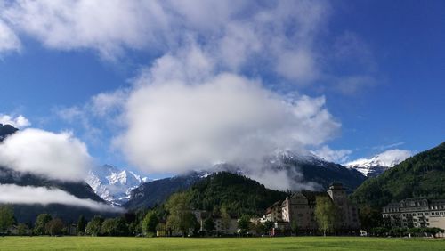 Panoramic view of landscape against blue sky