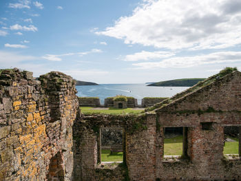 Old ruin building against cloudy sky
