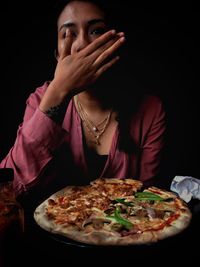 Portrait of a serious young woman in restaurant