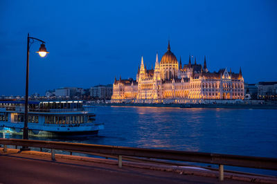 Illuminated buildings at waterfront