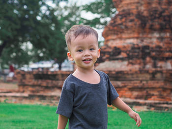 Portrait of boy standing outdoors