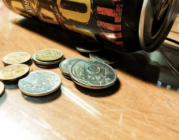 High angle view of coins on table