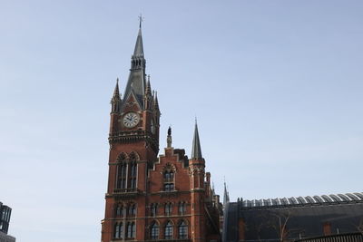 Low angle view of clock tower against sky