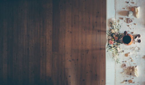 Directly above shot of place setting on table over hardwood floor