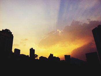Silhouette of buildings at sunset