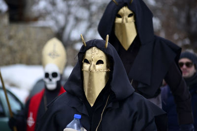 People wearing mask during event in city