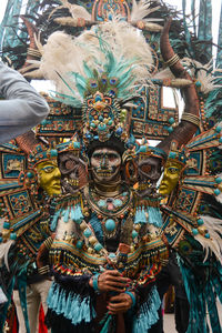 Rear view of woman standing in temple