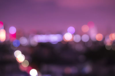 Defocused image of illuminated lights at night