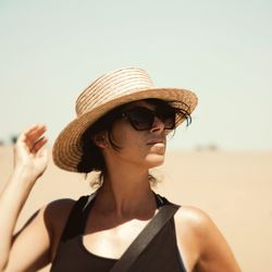 Portrait of man wearing sunglasses against clear sky