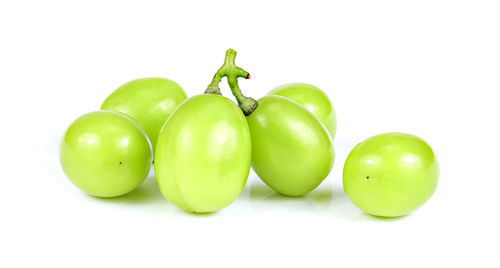 Close-up of apples on green background