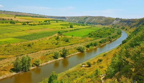 Scenic view of river amidst trees against sky, orhei moldova