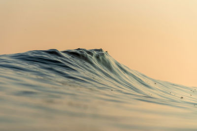 Scenic view of desert against sky during sunset