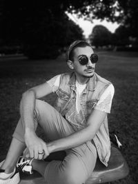 Man wearing sunglasses while sitting on seat