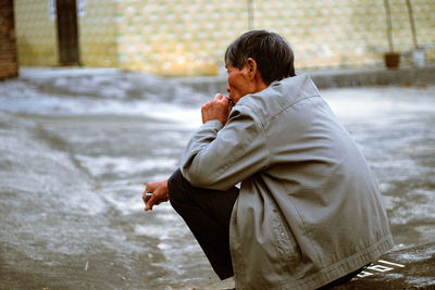 Side view of man standing in winter