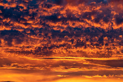 Low angle view of dramatic sky during sunset