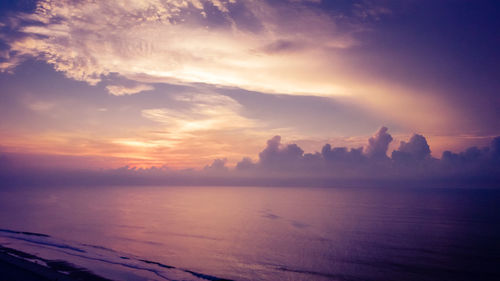 Scenic view of sea against sky at sunset