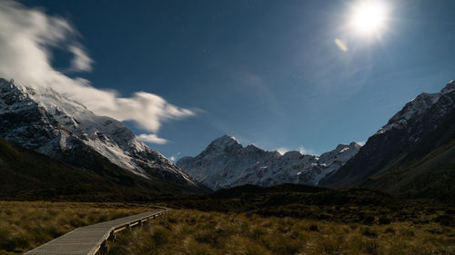 Scenic view of mountains against sky at night