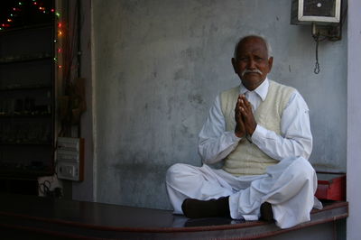 Portrait of man sitting at home