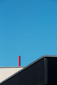 Low angle view of building against blue sky