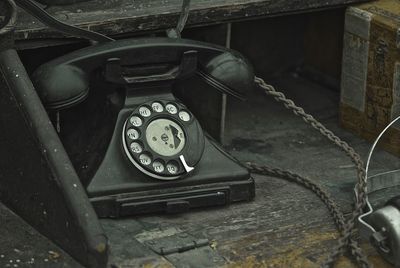Old telephone on table